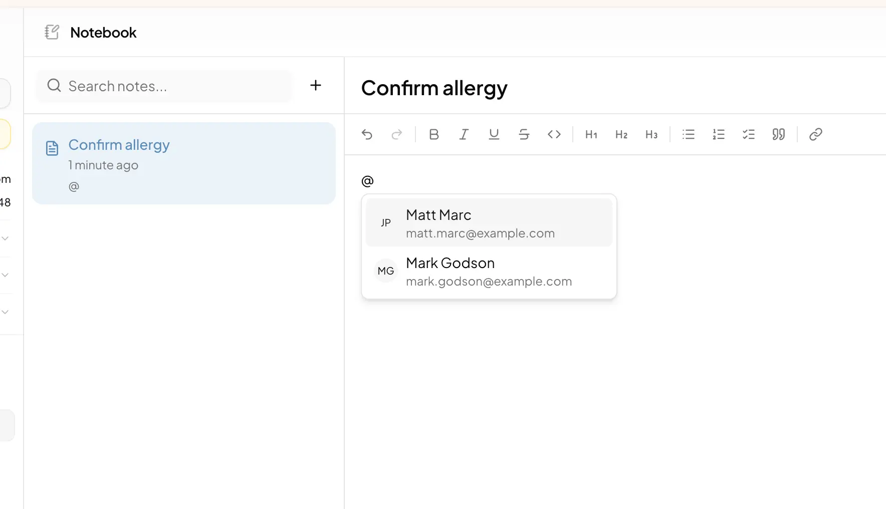 The mention picker open in a task description, showing matching team members